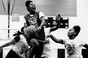 Black And White Image Of A Teen Girls B-Ball Game